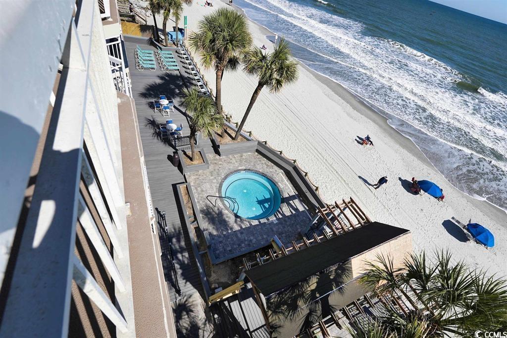 1012 North Waccamaw Drive, Unit 305 Murrells Inlet, SC 29576 - Photo 37 of 38 Aerial view of extended coastline and a pool