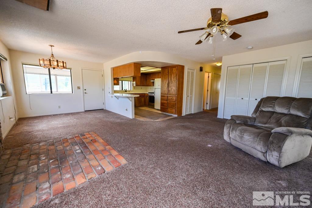 559 Mule Deer Road Coleville, CA 96107 - Photo 19 of 40 a living room with furniture and a large window