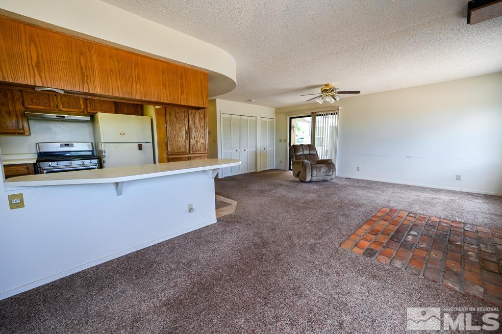 559 Mule Deer Road Coleville, CA 96107 - Photo 20 of 40 a view of a livingroom with furniture and a window