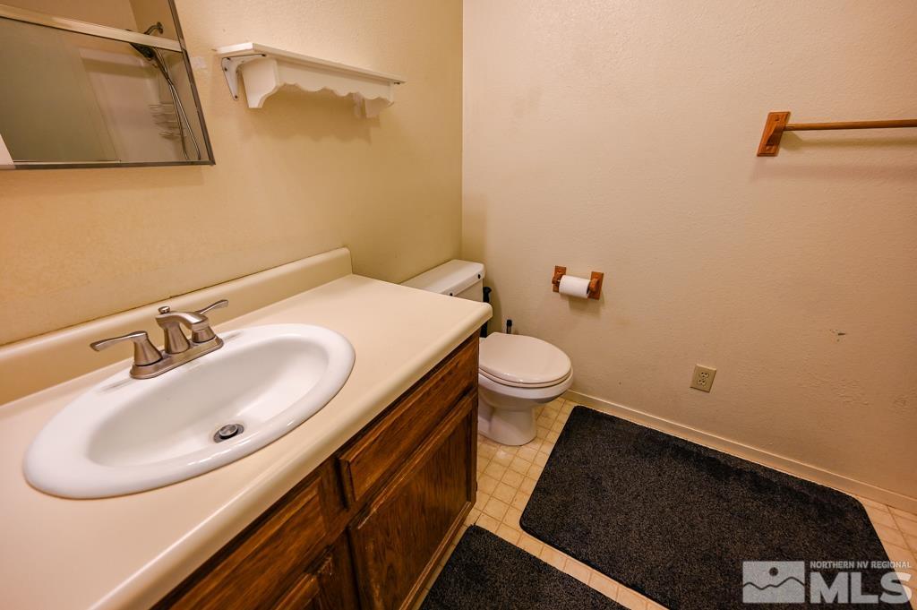 559 Mule Deer Road Coleville, CA 96107 - Photo 24 of 40 a bathroom with a sink and a toilet