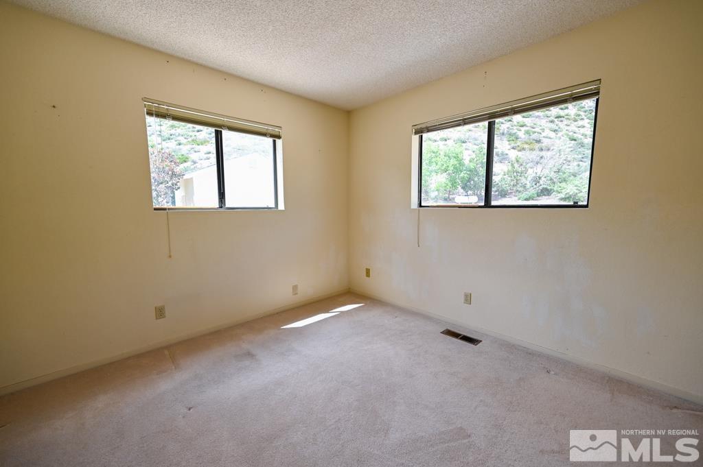 559 Mule Deer Road Coleville, CA 96107 - Photo 29 of 40 an empty room with a window