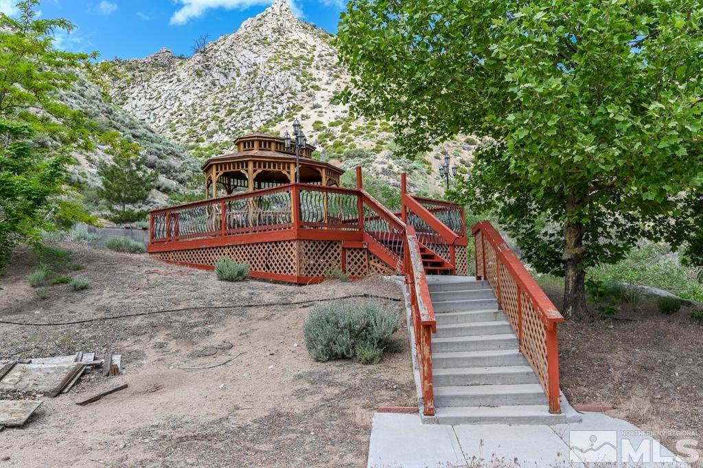 559 Mule Deer Road Coleville, CA 96107 - Photo 4 of 40 a view of a wooden house with large trees