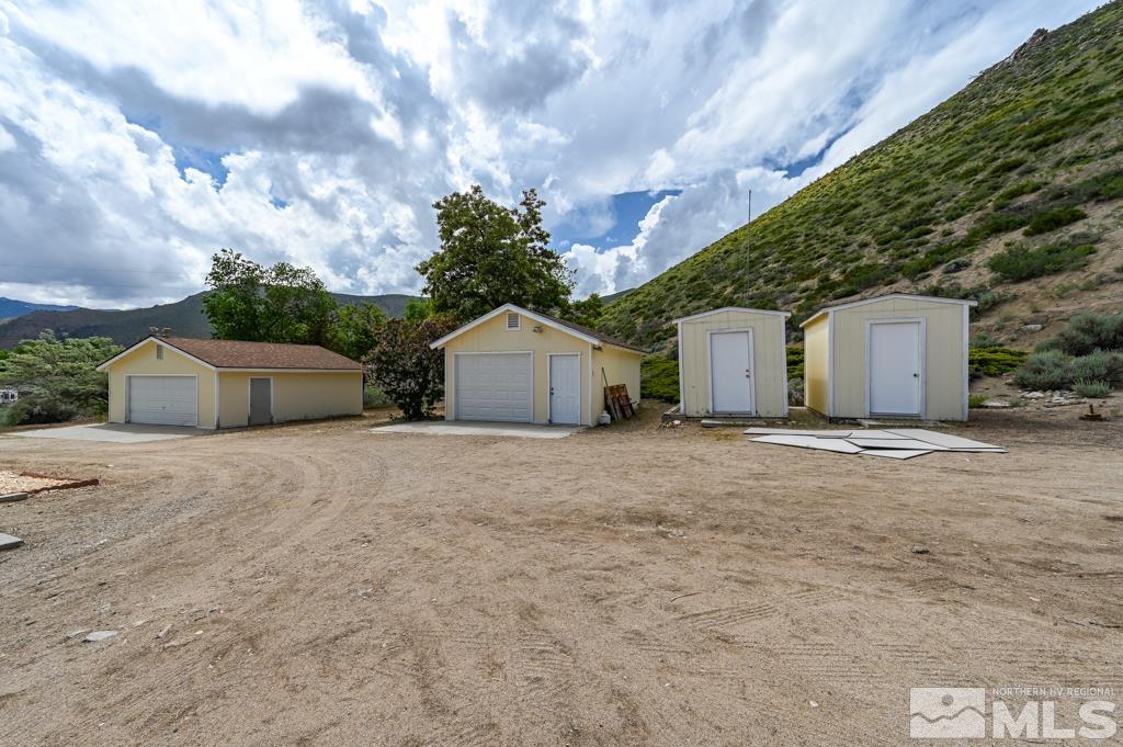 559 Mule Deer Road Coleville, CA 96107 - Photo 9 of 40 a view of a house with a backyard and bushes