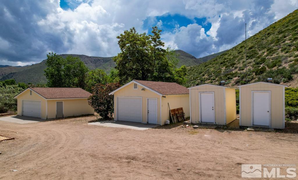 559 Mule Deer Road Coleville, CA 96107 - Photo 10 of 40 a view of a house with a yard and large tree