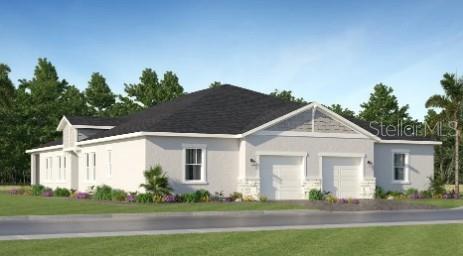 4246 St Thomas Way Kissimmee, FL 34758 - Photo 2 of 16 a front view of a house with a garden and plants