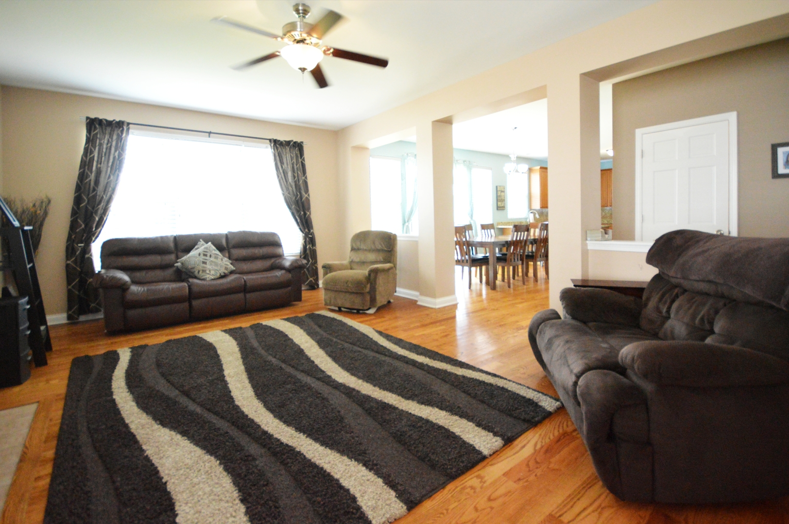 1504 Roth Drive Joliet, IL 60431 - Photo 12 of 27 a living room with furniture and a large window