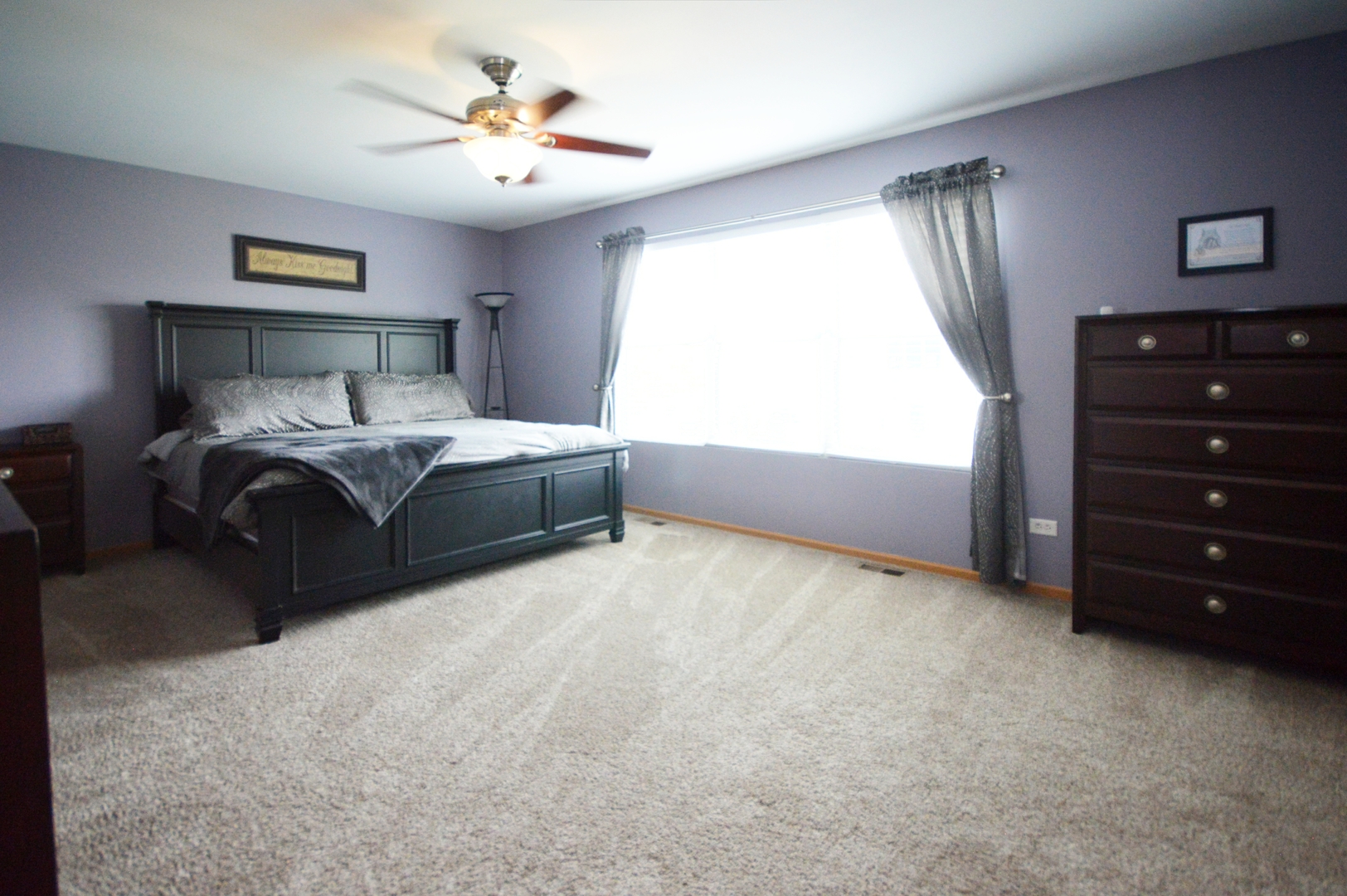 1504 Roth Drive Joliet, IL 60431 - Photo 15 of 27 a bedroom with a bed and a ceiling fan