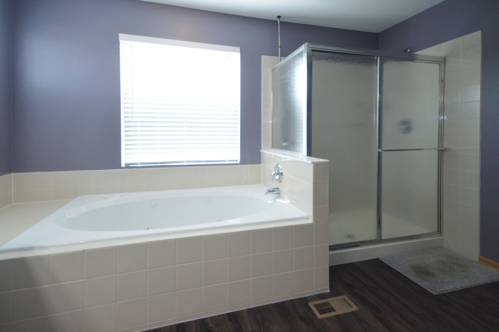 1504 Roth Drive Joliet, IL 60431 - Photo 18 of 27 a bathroom with a bathtub and a shower
