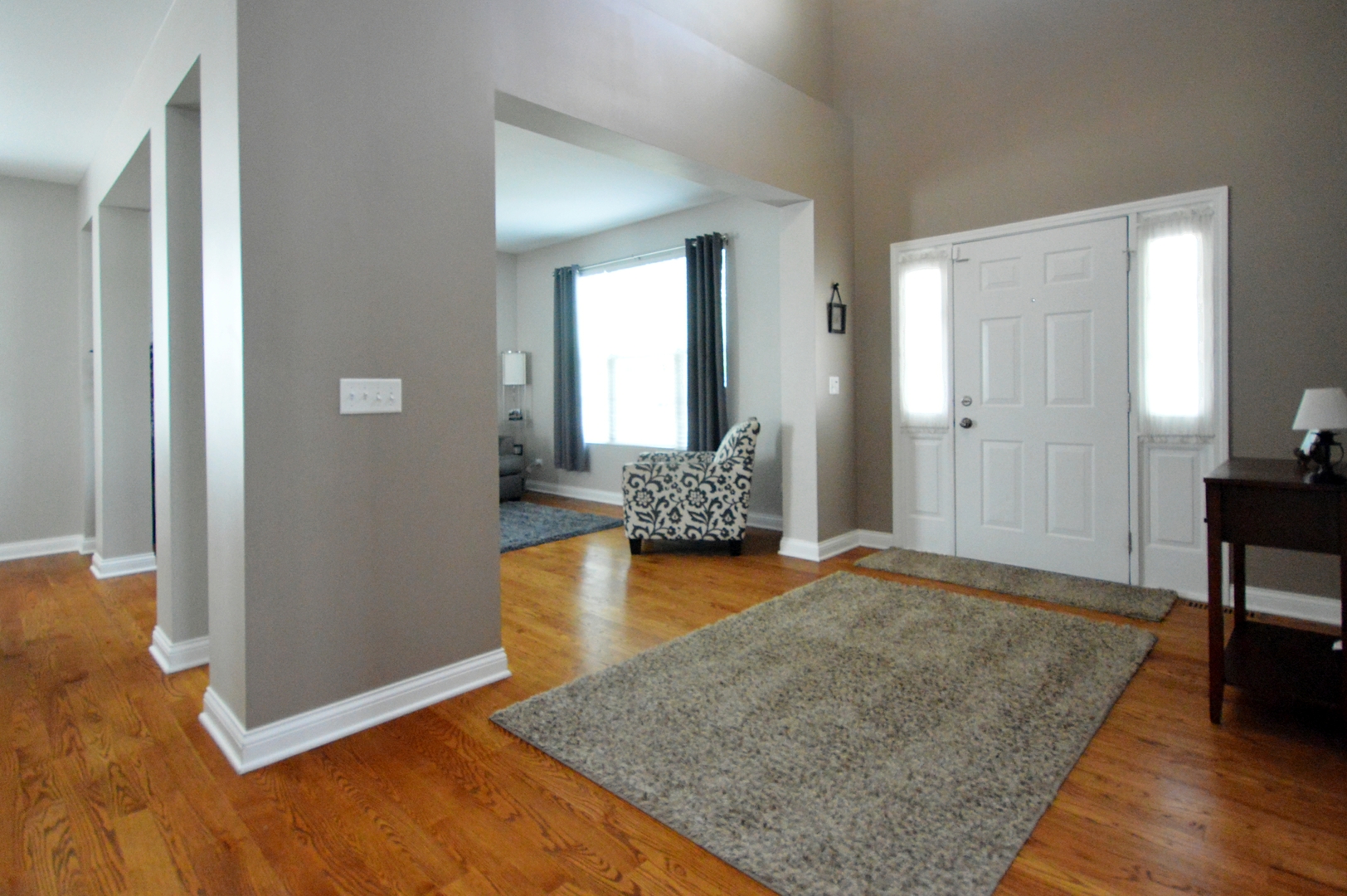 1504 Roth Drive Joliet, IL 60431 - Photo 3 of 27 a view of a livingroom with wooden floor and furniture
