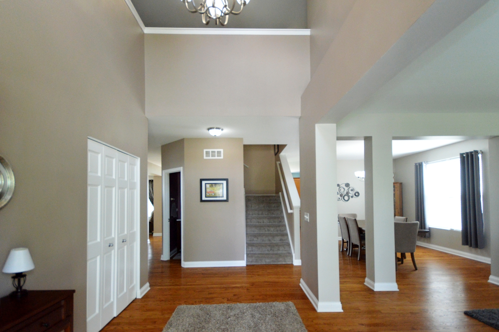 1504 Roth Drive Joliet, IL 60431 - Photo 4 of 27 a view of a hallway with wooden floor and a bathroom