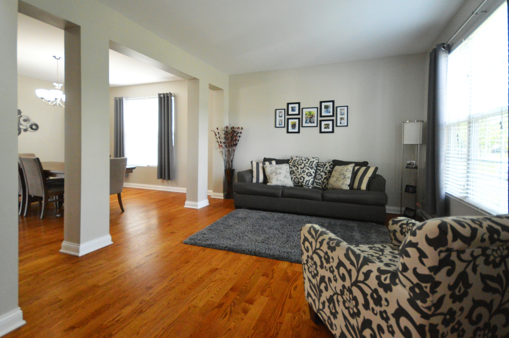 1504 Roth Drive Joliet, IL 60431 - Photo 5 of 27 a living room with furniture and a wooden floor