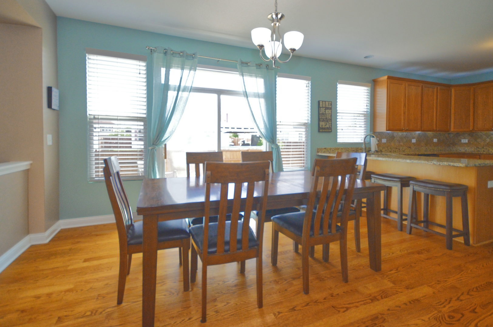 1504 Roth Drive Joliet, IL 60431 - Photo 10 of 27 a view of a dining room with furniture window and outside view