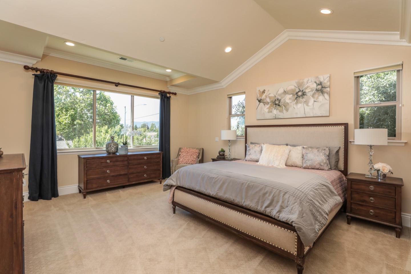 932 Marion Way Sunnyvale, CA 94087 - Photo 12 of 37 a bedroom with a large bed and a large window