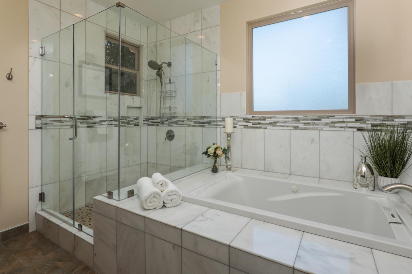 932 Marion Way Sunnyvale, CA 94087 - Photo 15 of 37 a bathroom with a tub sink and mirror