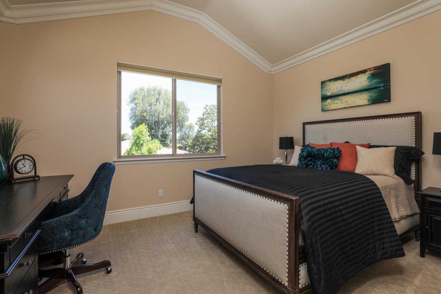 932 Marion Way Sunnyvale, CA 94087 - Photo 21 of 37 a bed sitting in a bedroom next to a window
