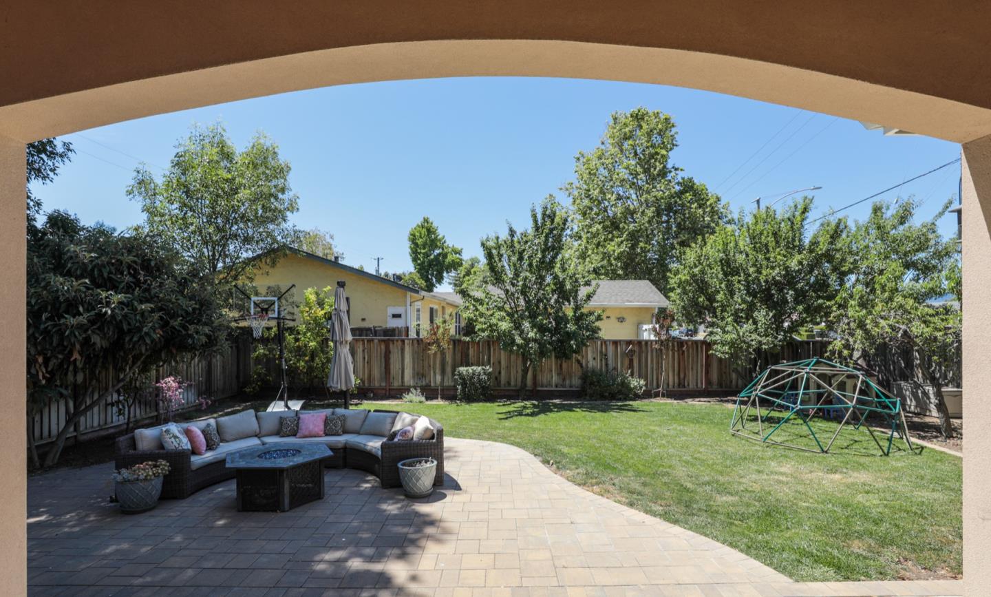 932 Marion Way Sunnyvale, CA 94087 - Photo 24 of 37 a view of a backyard with couches plants and large tree