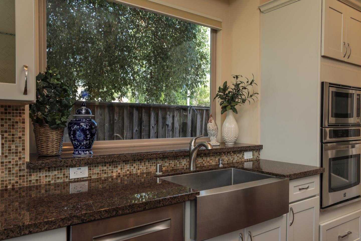 932 Marion Way Sunnyvale, CA 94087 - Photo 32 of 37 a kitchen with a sink and a refrigerator