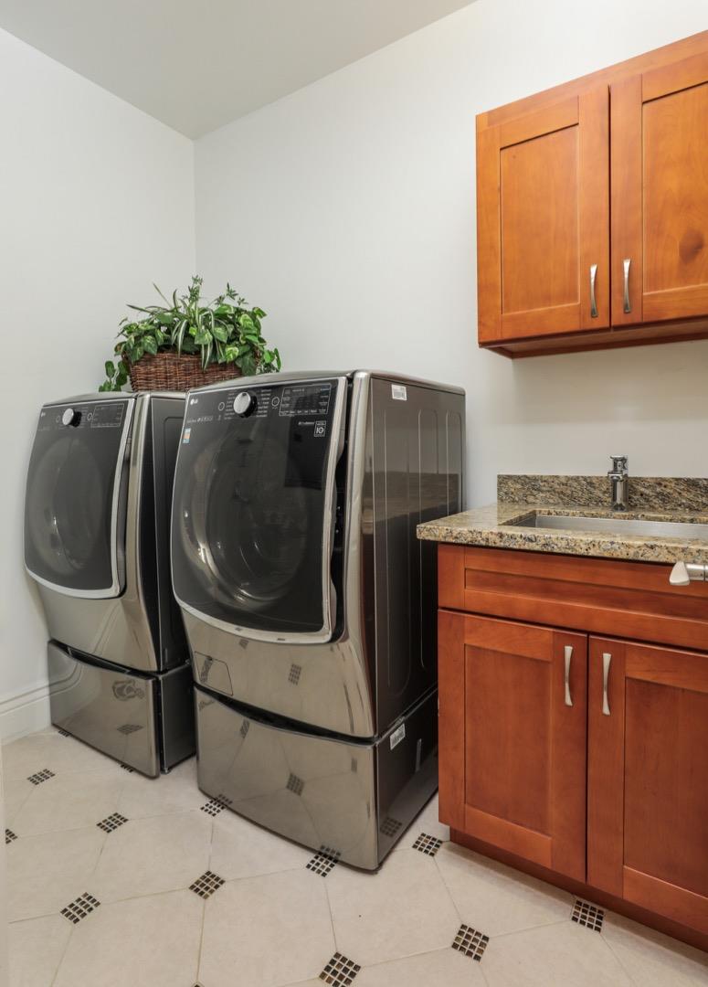 932 Marion Way Sunnyvale, CA 94087 - Photo 34 of 37 a utility room with granite countertop a sink a washer and dryer