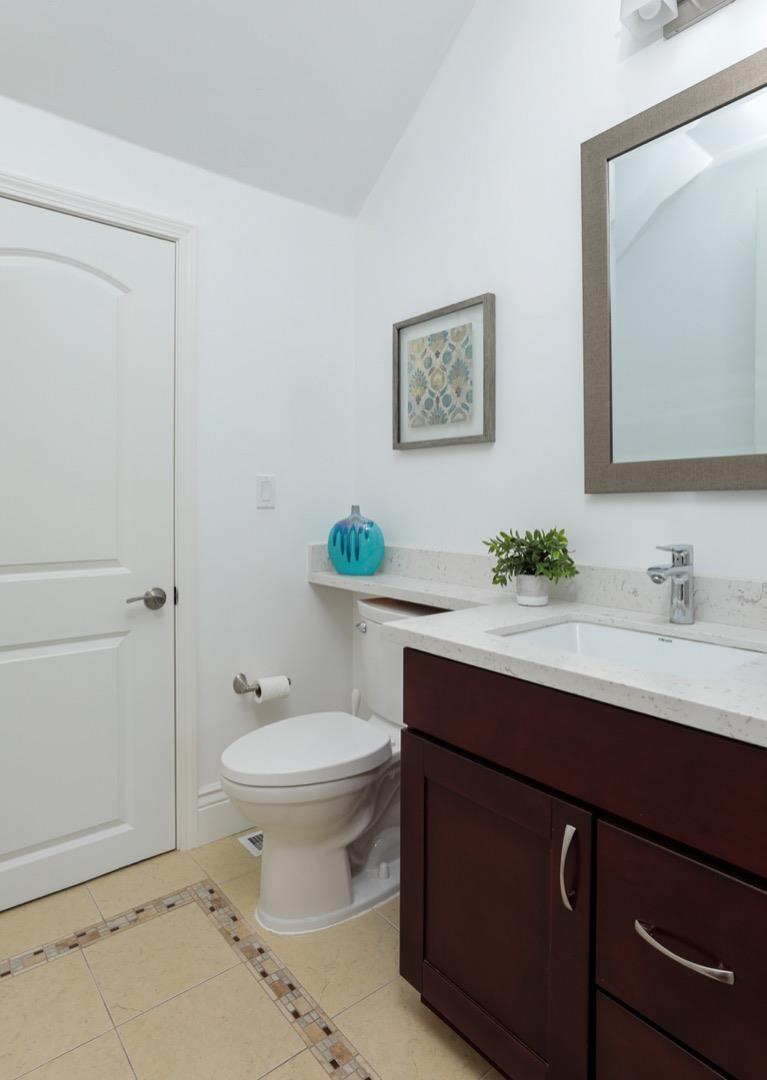 932 Marion Way Sunnyvale, CA 94087 - Photo 4 of 37 a bathroom with a sink toilet and a mirror