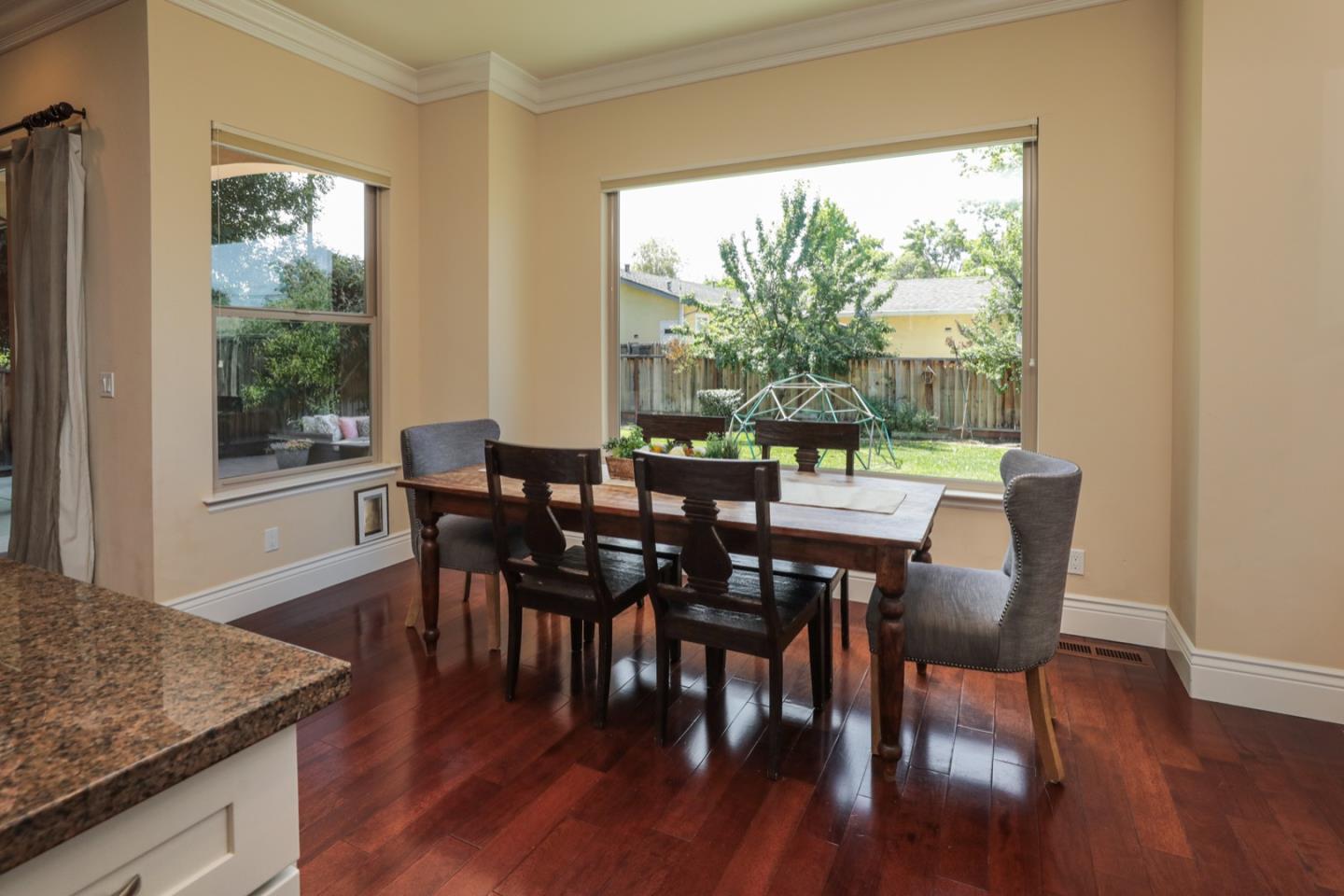 932 Marion Way Sunnyvale, CA 94087 - Photo 6 of 37 a view of a dining room with furniture and wooden floor