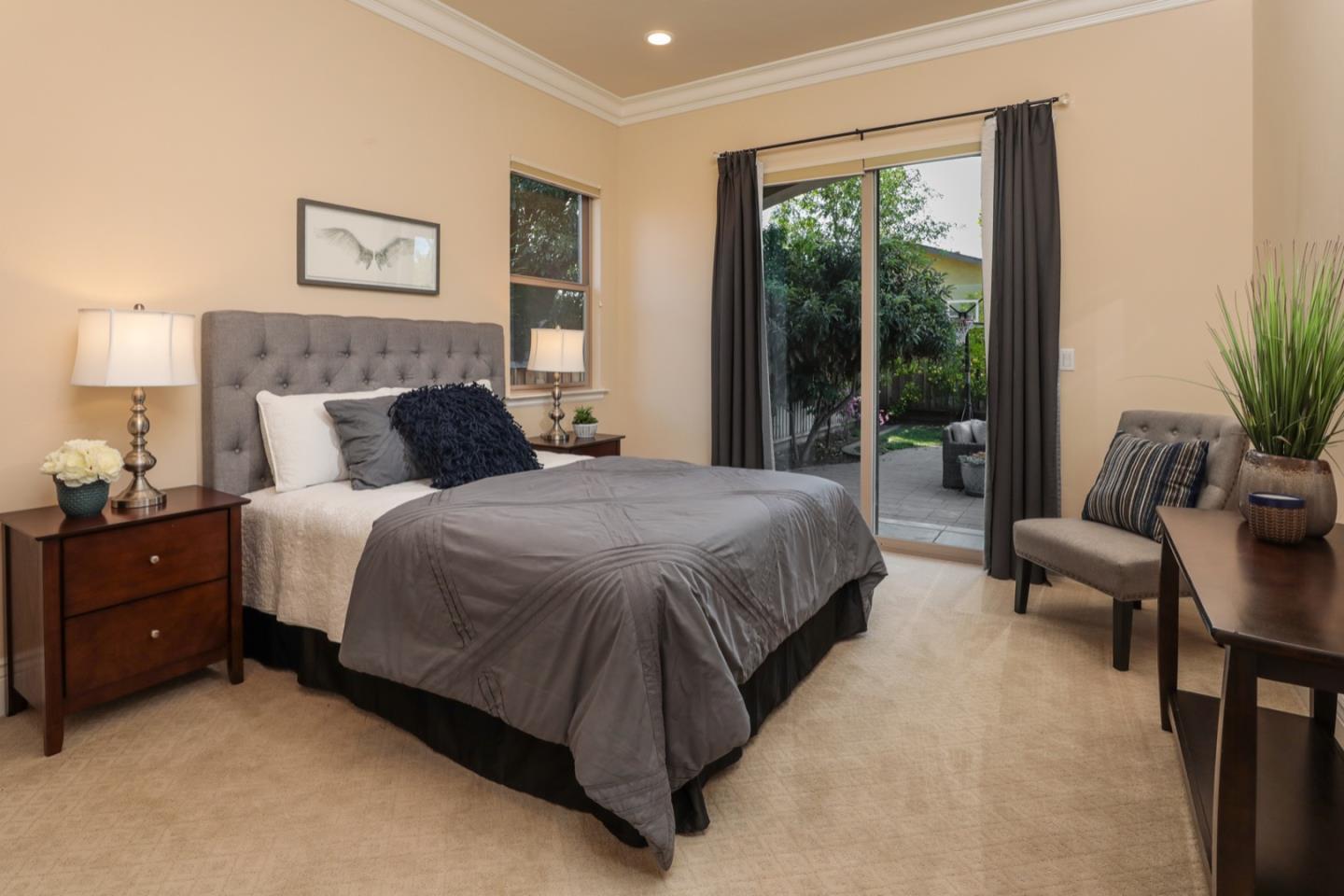 932 Marion Way Sunnyvale, CA 94087 - Photo 8 of 37 a bedroom with a bed and a couch next to a window