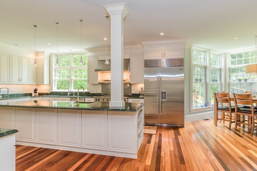108 Grapevine Road Wenham, MA 01984 - Photo 17 of 37 a kitchen with a sink and wooden cabinets