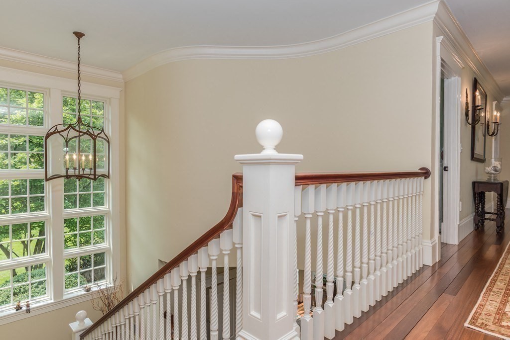 108 Grapevine Road Wenham, MA 01984 - Photo 21 of 37 a view of a hallway with windows