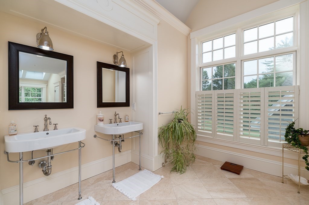 108 Grapevine Road Wenham, MA 01984 - Photo 25 of 37 a bathroom with a sink and a mirror