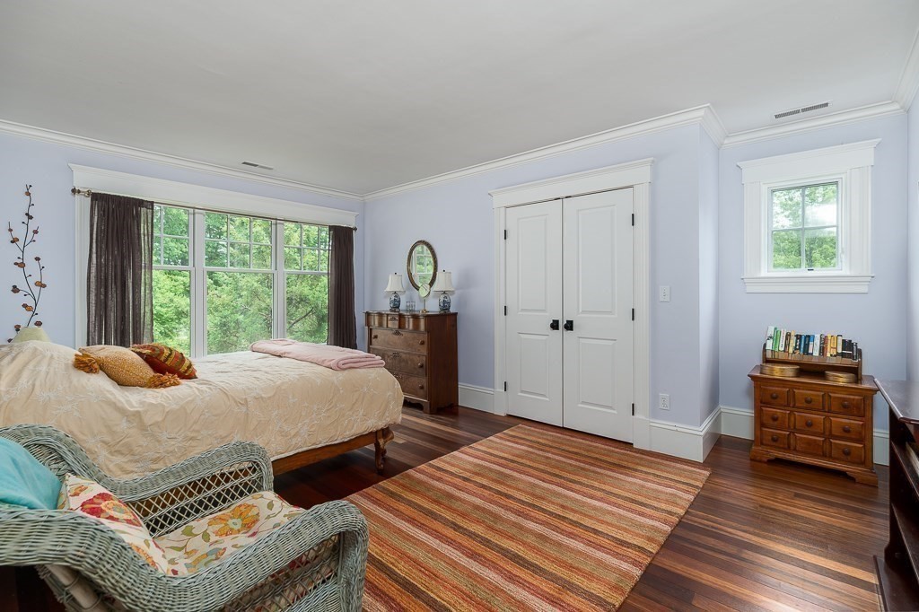 108 Grapevine Road Wenham, MA 01984 - Photo 29 of 37 a bedroom with a bed and wooden floor