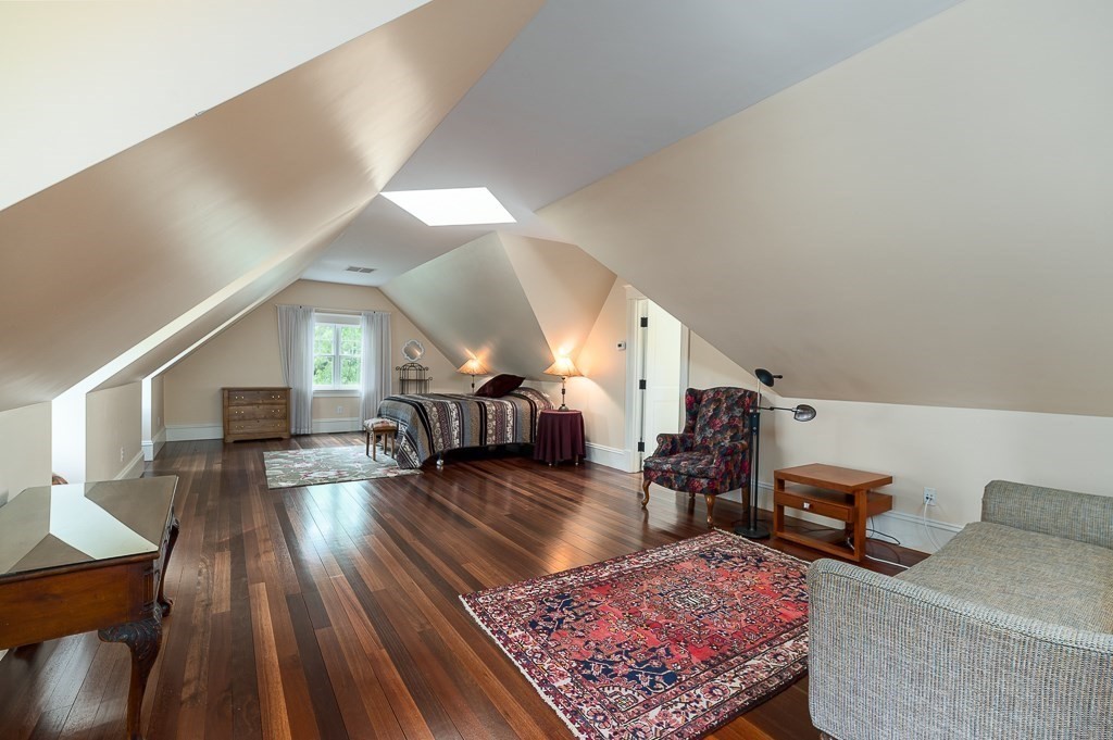 108 Grapevine Road Wenham, MA 01984 - Photo 32 of 37 a living room with furniture and a wooden floor