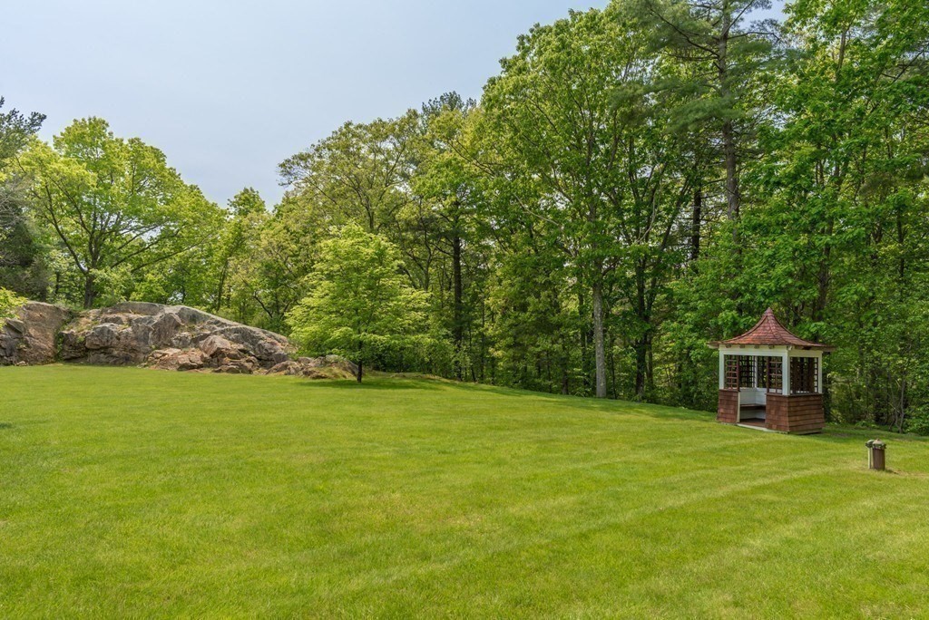 108 Grapevine Road Wenham, MA 01984 - Photo 4 of 37 a house with a garden