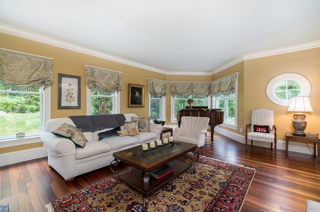 108 Grapevine Road Wenham, MA 01984 - Photo 9 of 37 a living room with furniture and a large window