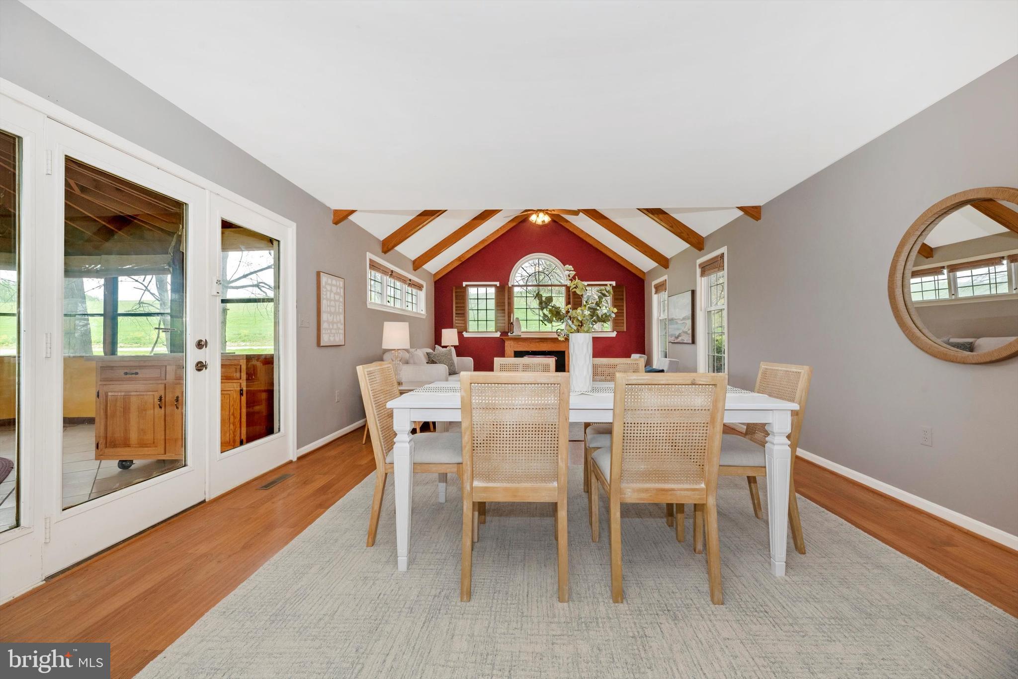 2801 Grandview Drive Middletown, MD 21769 - Photo 16 of 59 a dining room with furniture a rug and a large window