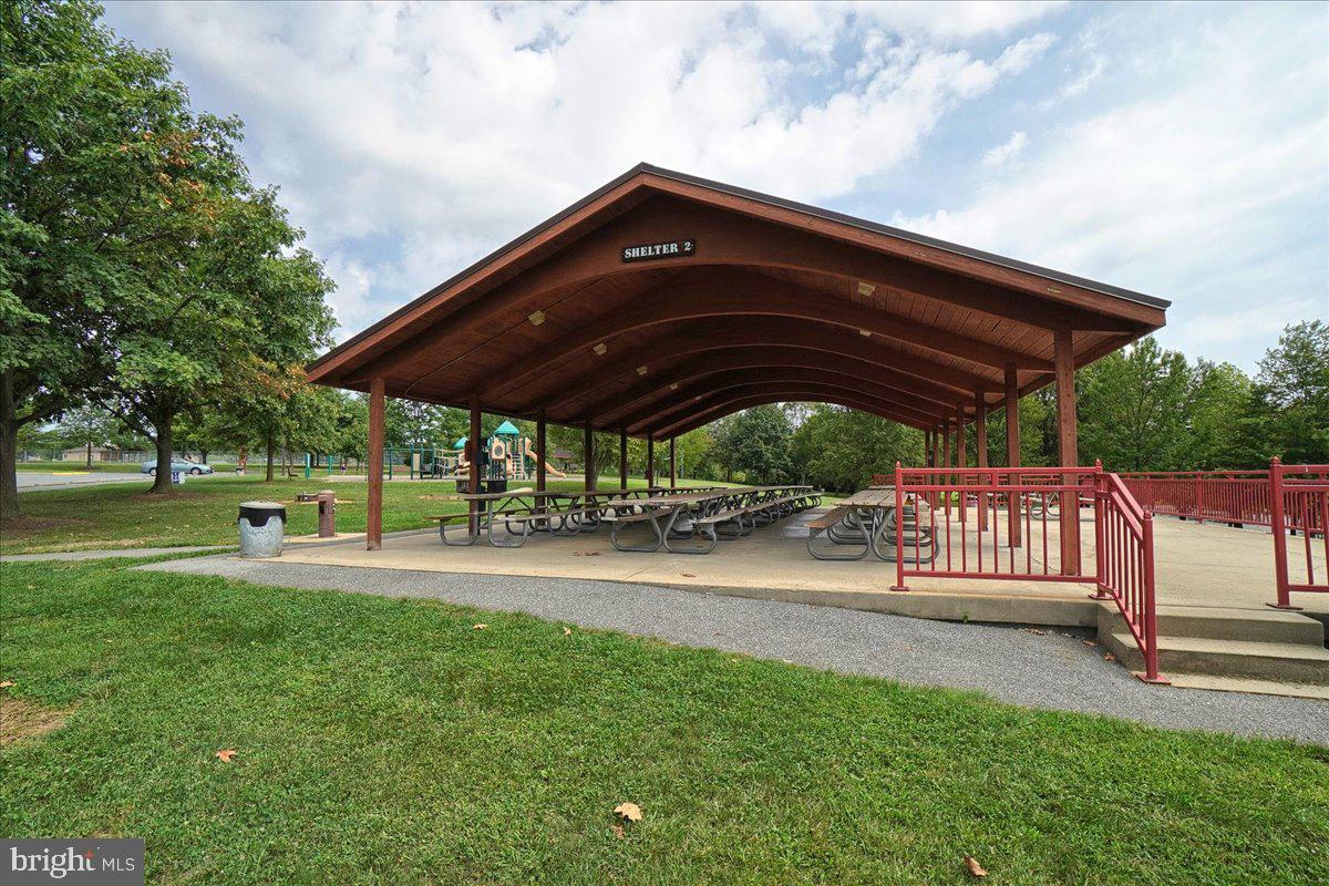 2801 Grandview Drive Middletown, MD 21769 - Photo 43 of 59 a view of patio with a table and chairs under an umbrella