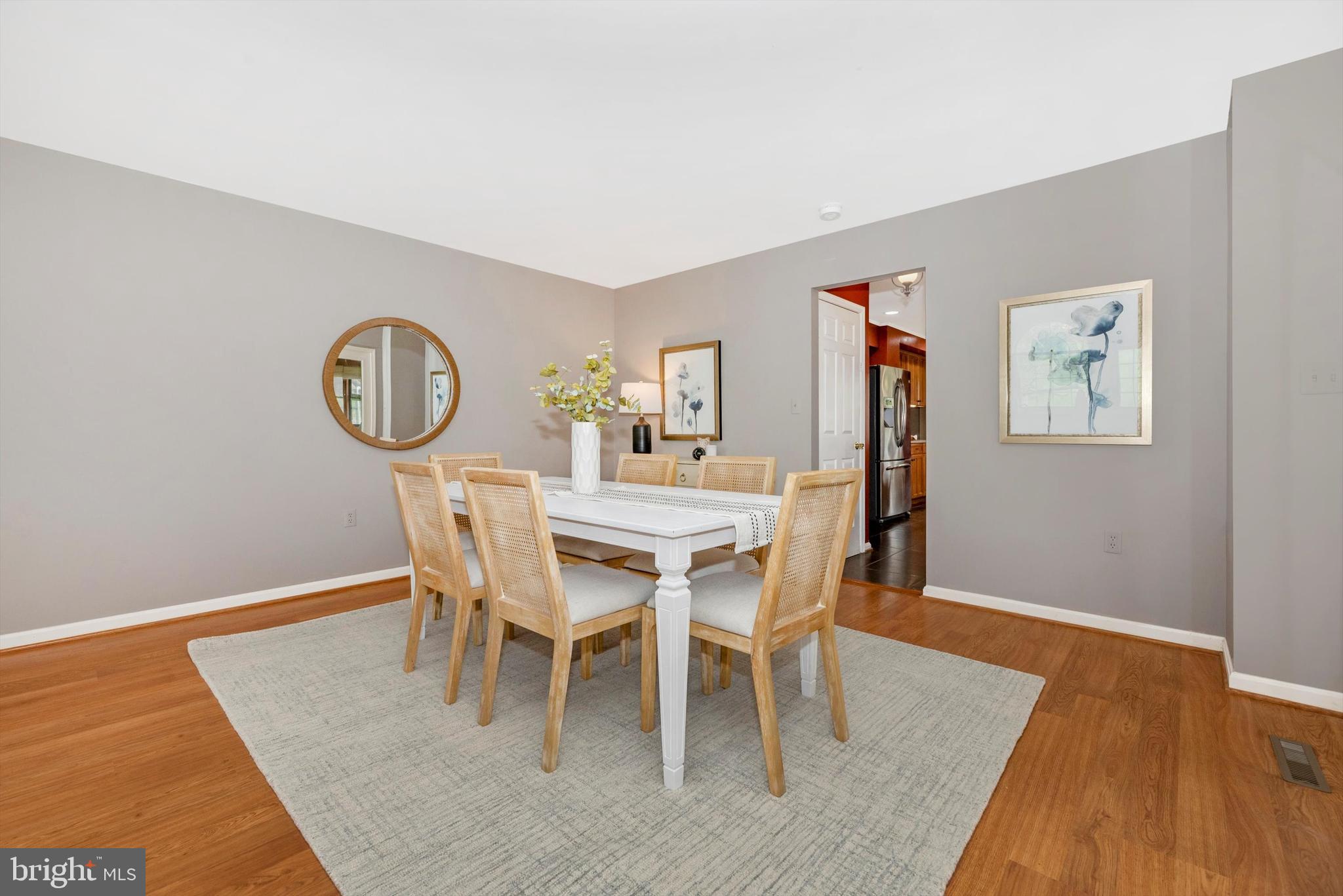 2801 Grandview Drive Middletown, MD 21769 - Photo 8 of 59 a dining room with furniture a rug and wooden floor