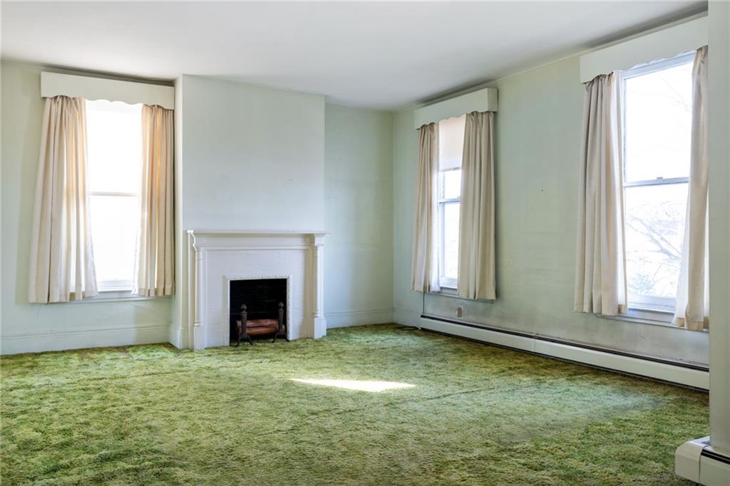 701 Beaver Street Sewickley, PA 15143 - Photo 18 of 39 a view of an empty room with window and fire place