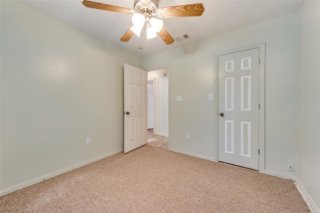 106 South 3rd Avenue Mansfield, TX 76063 - Photo 24 of 30 an empty room with a chandelier fan and closet area