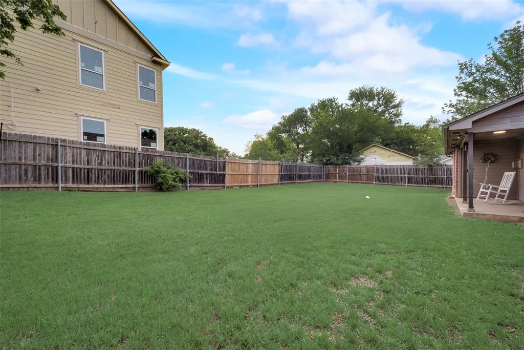 106 South 3rd Avenue Mansfield, TX 76063 - Photo 27 of 30 a view of a house with a backyard