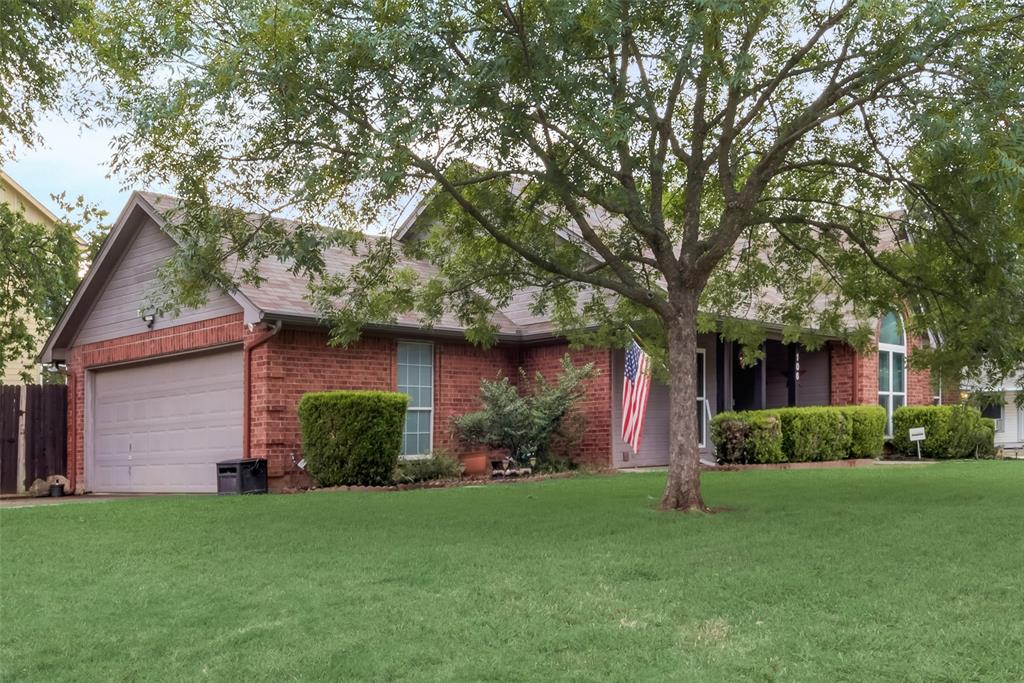 106 South 3rd Avenue Mansfield, TX 76063 - Photo 30 of 30 a view of a yard in front of a house with plants and large tree