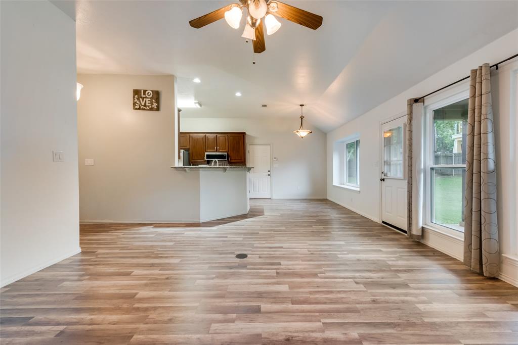 106 South 3rd Avenue Mansfield, TX 76063 - Photo 5 of 30 a view of a livingroom with a flat screen tv