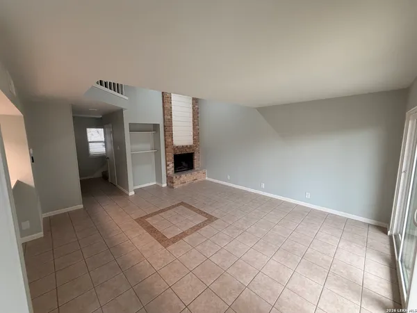 a view of an empty room and window