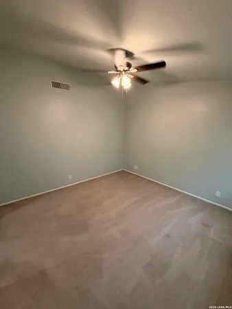 a view of a small space with a fan