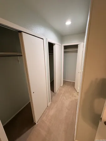a view of hallway with hallway and closet