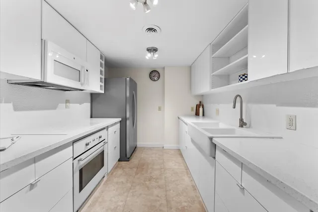 a kitchen with cabinets and sink