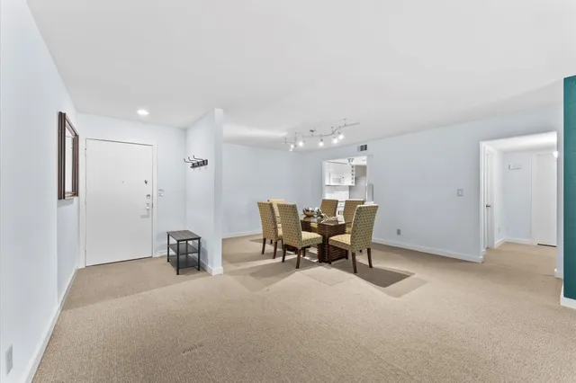 a view of a livingroom with furniture and a window