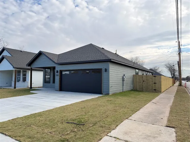 a front view of house with yard
