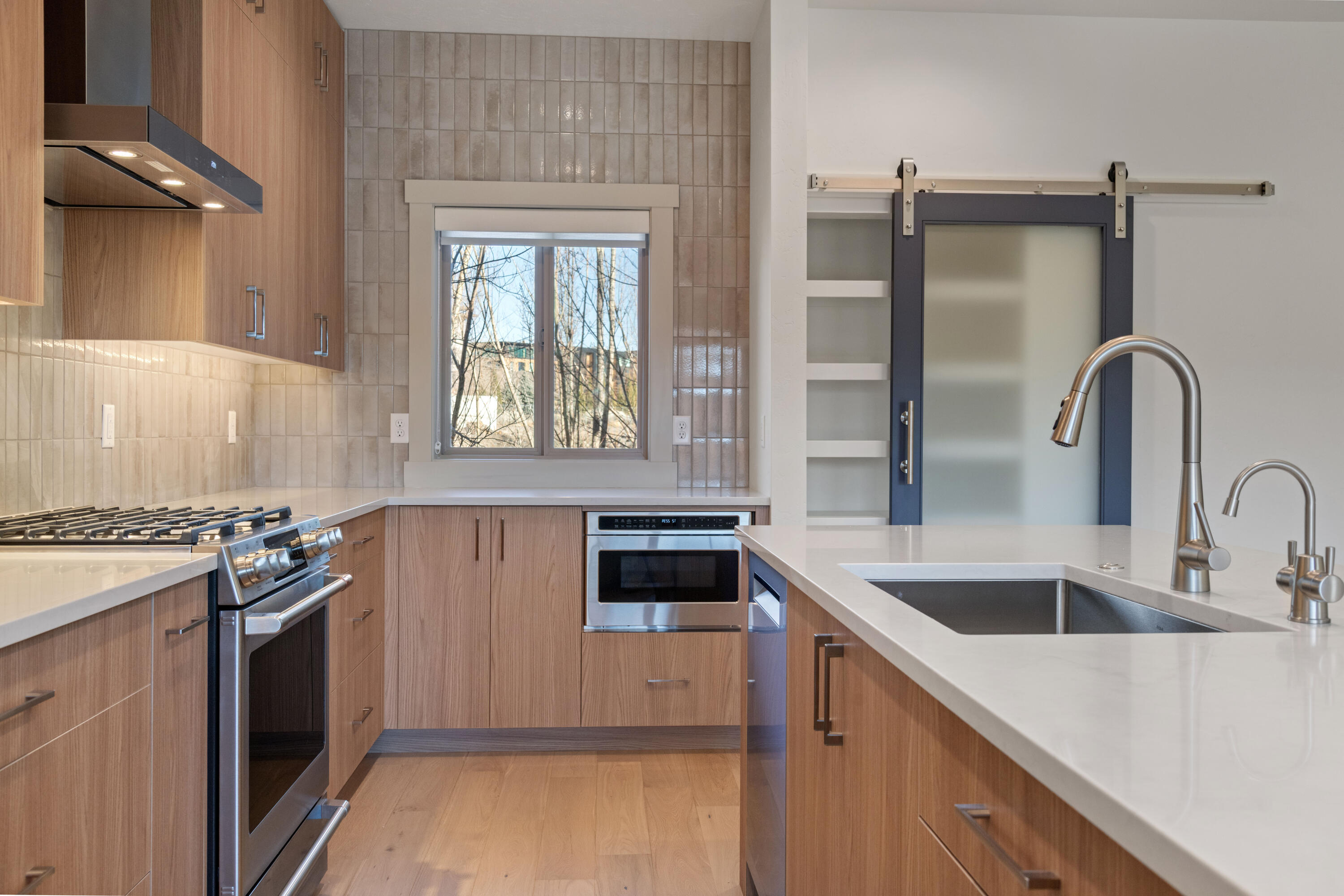 680 Southwest Otter Way Bend, OR 97702 - Photo 22 of 48 a kitchen with a stove and a sink