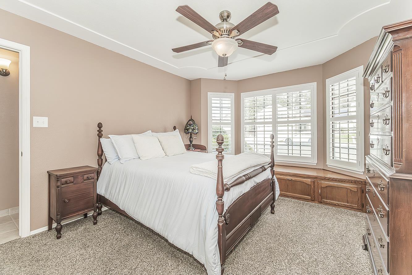 1405 West Flora Avenue Reedley, CA 93654 - Photo 33 of 61 a bed room with a bed and a large window