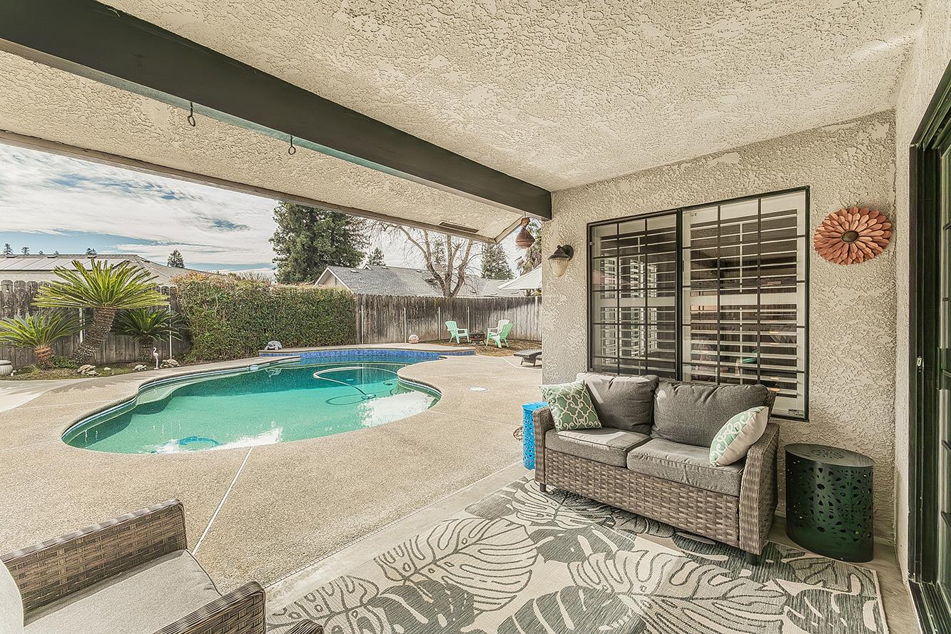 1405 West Flora Avenue Reedley, CA 93654 - Photo 46 of 61 a living room with furniture and a large window