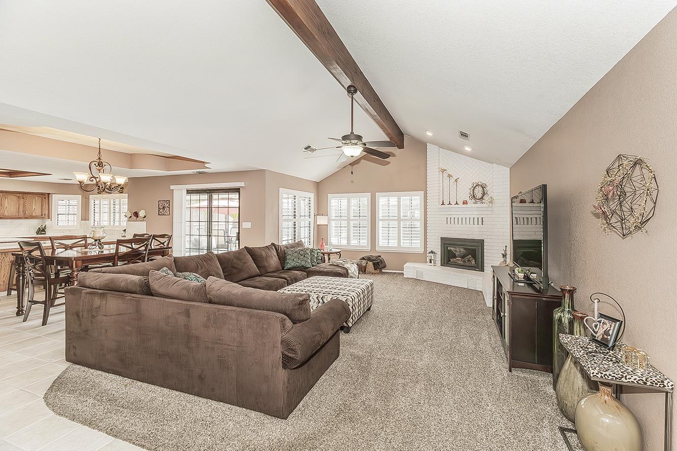 1405 West Flora Avenue Reedley, CA 93654 - Photo 7 of 61 a living room with furniture and a large window